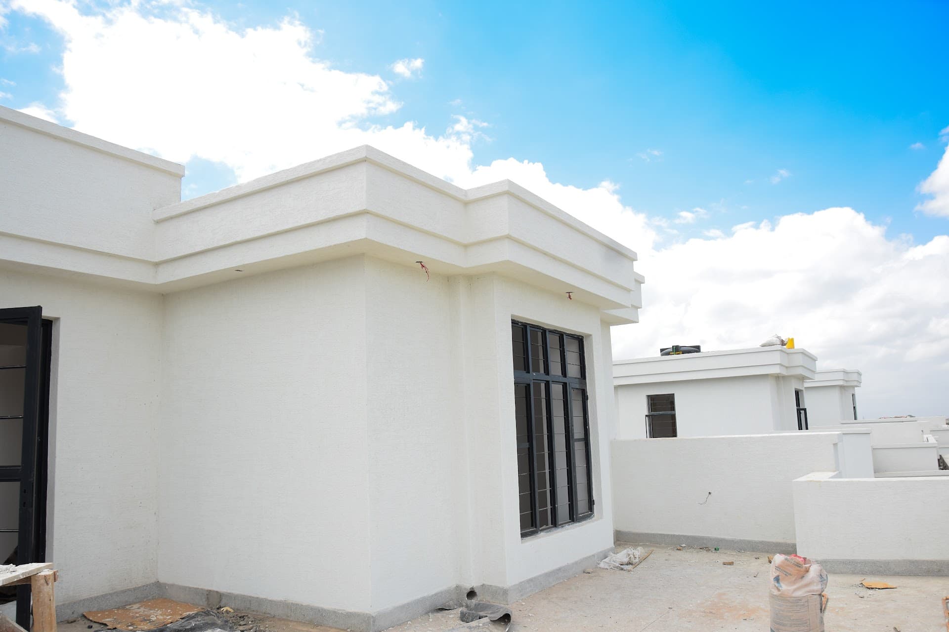 Flat Concrete Roof Waterproofing in Kenya: Torch-On Membrane vs Liquid Acrylic